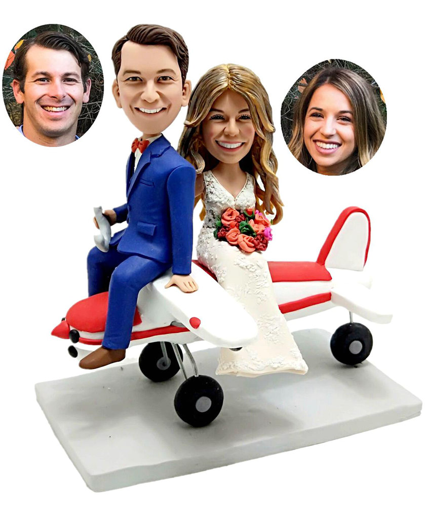 Custom cake toppers sitting on airplane travelling cake toppers
